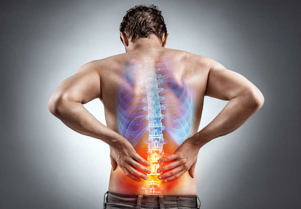 Man holding his lower back with a highlighted painful spine